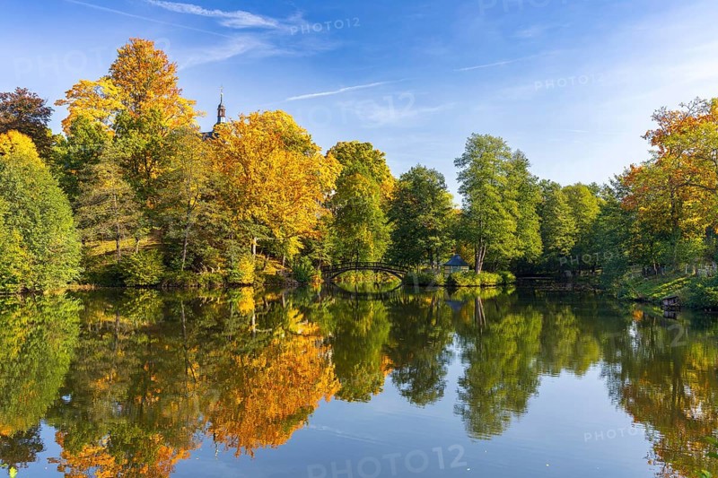 Castle pond with bridge and Pfaffroda Castle in autumn, Olbernhau, Erzgebirge, Saxony, Germany, Europe