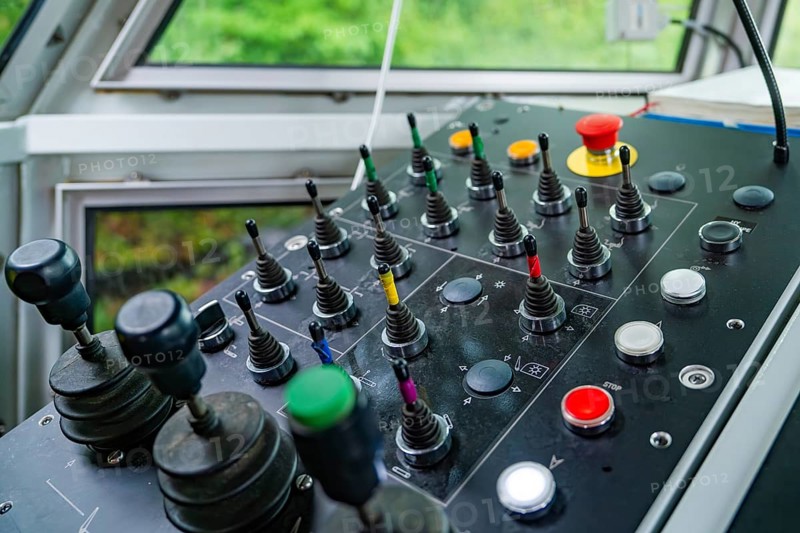 Detail of a control panel with numerous colour-coded levers and buttons, Hermann Hesse Bahn track construction, Calw district, Black Forest, Germany, Europe