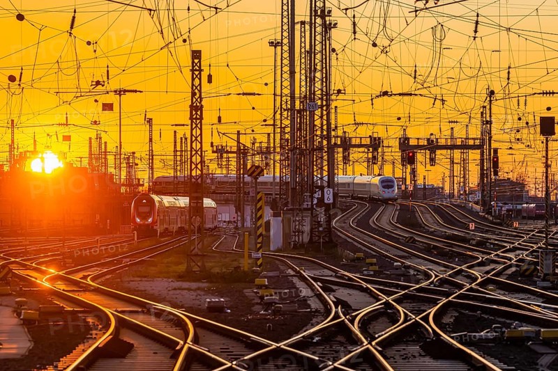 Track apron with trains, rails, points, pylons and signalling systems. Infrastructure at the main station. Sunset. Frankfurt am Main, Hesse, Germany, Europe