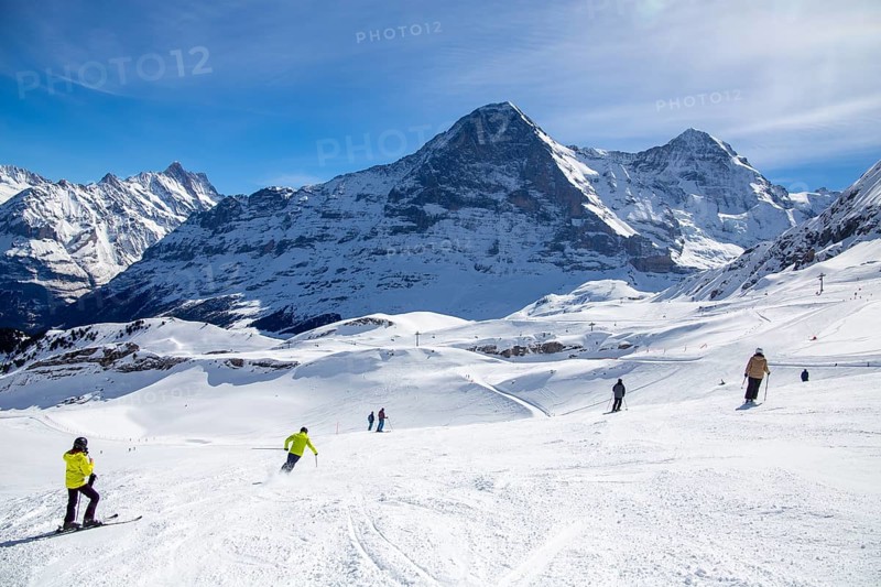 Skiing against the backdrop of the north face of the Eiger in Grindelwald, Switzerland, Europe