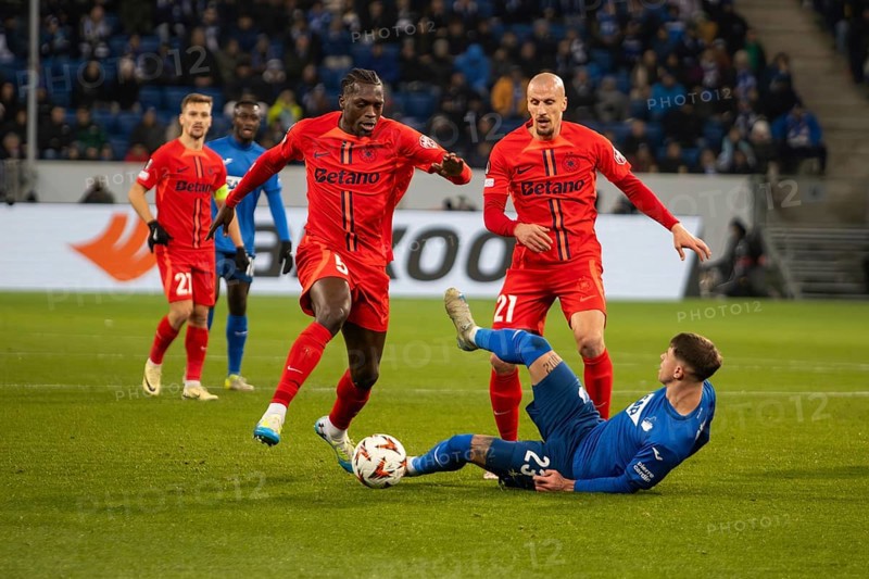 Football UEFA Europa League, 2024/25 season, matchday 6: TSG Hoffenheim v Steaua Bucharest. Photo: Foul by Joyskim Dawa (5, Bucharest) on Adam Hlozek (23, Hoffenheim)