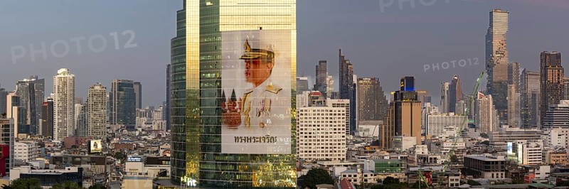 Panorama from the viewing platform of the Iconsiam on CAT Tower with huge billboard of the Thai King Maha Vajiralongkorn, skyscrapers, hotels and the banking district Bang Rak, skyline of Bangkok, Thailand, Asia