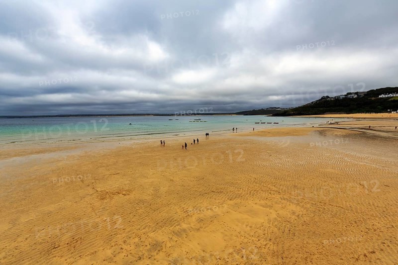 Walkers on the beach at low tide, cloud cover, St. Ives, England, Great Britain