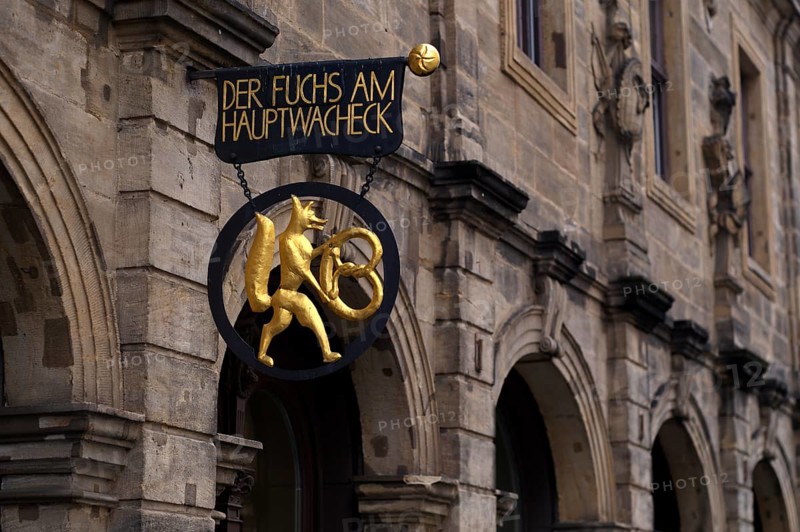 Fox with pretzel, nose sign of the bakery Der Fuchs am Hauptwacheck, café, Bamberg, Upper Franconia, Bavaria, Germany, Europe