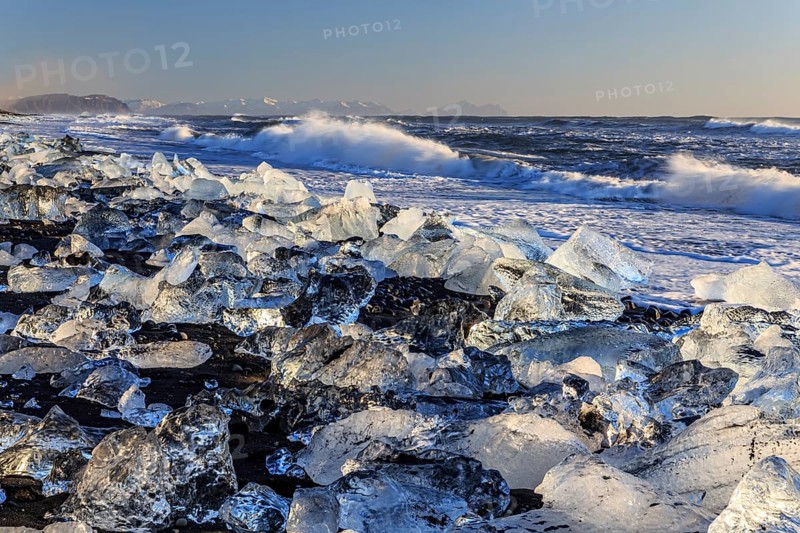 Ice floes on the beach, waves, sea, sunny, morning light, winter, Diamond Beach, Breidamerkursandur, Jökulsarlon, Iceland, Europe