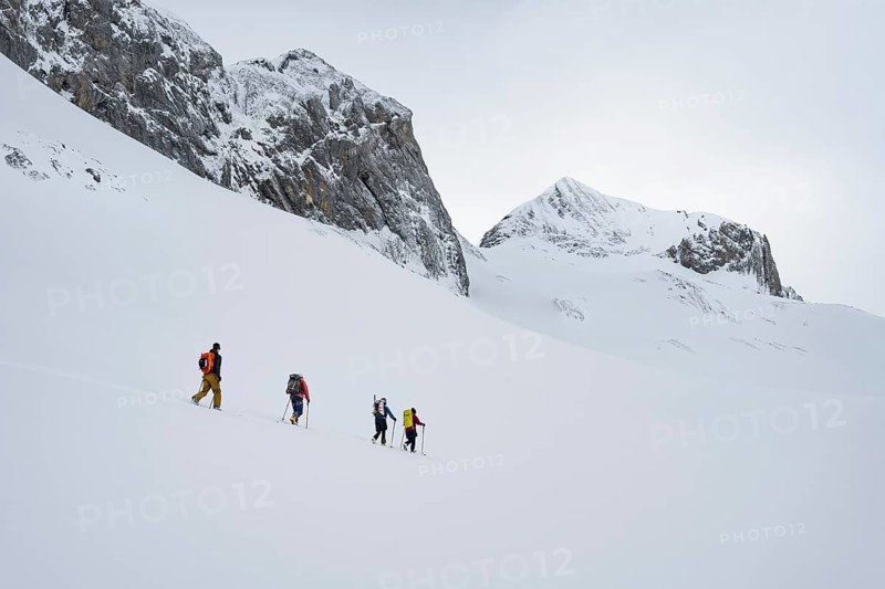 Ski tourers in a snowy mountain landscape, ascent to the Wildhorn, cloudy mood, high tour, Bernese Alps, Bernese Oberland, Switzerland, Europe
