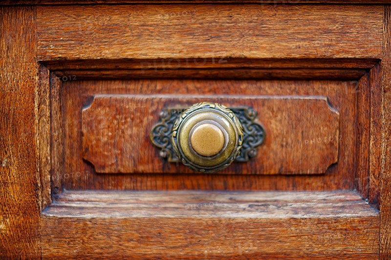 Brass door knob, mounted on the panelled panel of a wooden door, Alter Peter in Munich, Bavaria, Germany, Europe