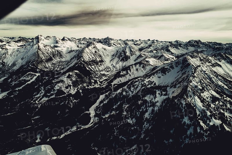 Flight over the late winter Lech Valley with a small aeroplane in Tyrol, Austria, Europe