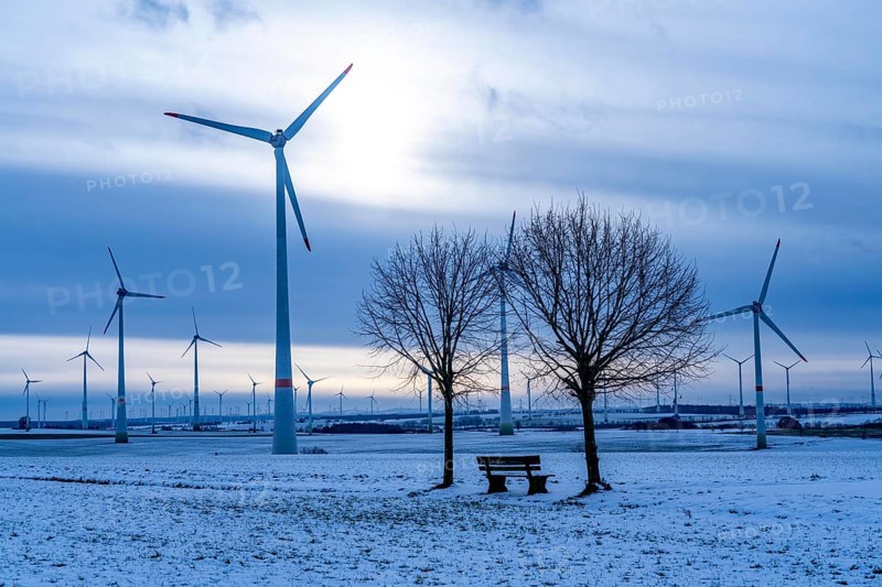 Wind farm, north of Lichtenau, self-proclaimed energy town, over 190 wind turbines and over 1200 solar panels generate 10 times as much electricity as the community of 11, 900 inhabitants consumes, largest onshore cluster of wind turbines in Germany, winter, slightly snow-covered landscape, North Rhine-Westphalia, Germany, Europe