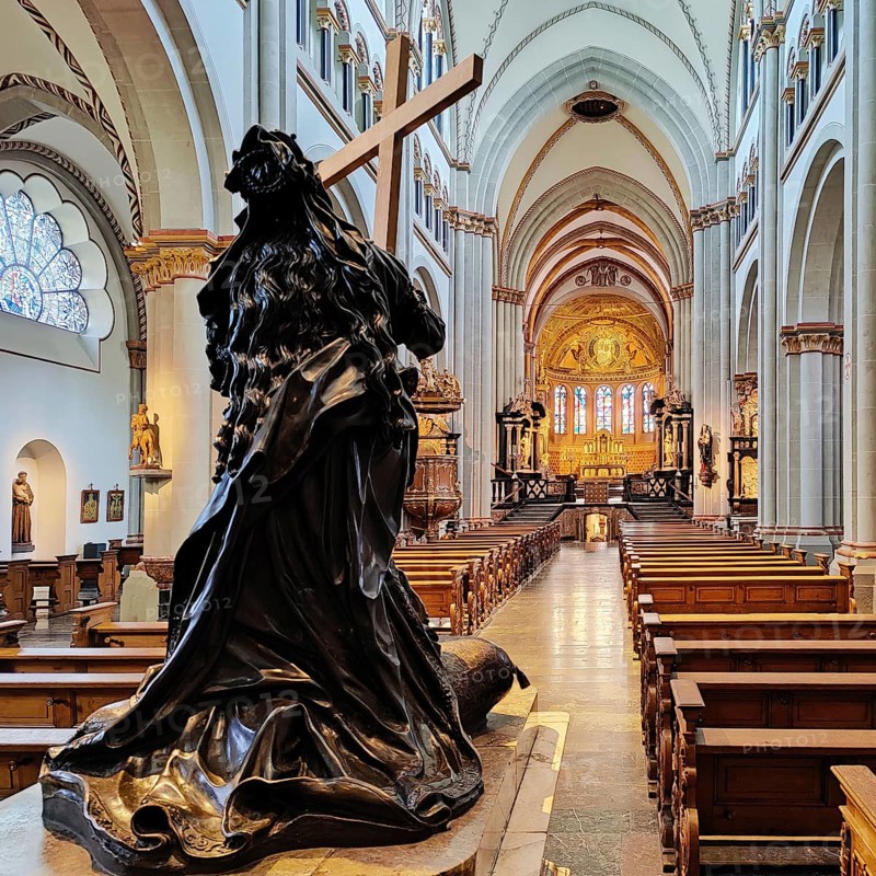 Interior view of Bonn Minster, bronze statue of St Helena with nave and view to the east apse, Bonn, North Rhine-Westphalia, Germany, Europe