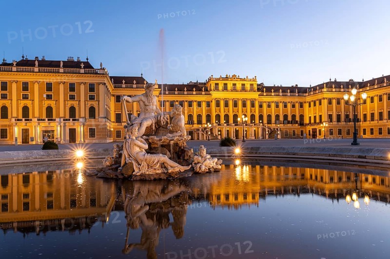 Fountain in the courtyard of honour at Schönbrunn Palace at dusk, UNESCO World Heritage Site in Vienna, Austria, Europe