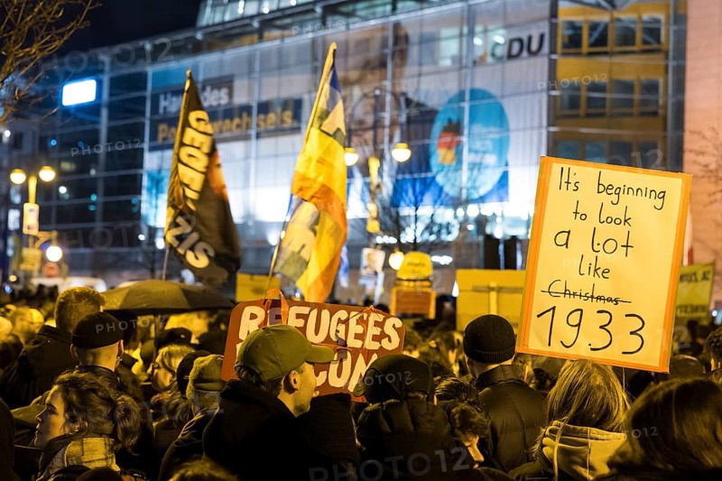 Participants in the demonstration under the slogan Brandmauer statt Brandstifter / Asylrecht verteidigen in front of the Konrad-Adenauer-Haus, the party headquarters of the CDU, after a joint vote by the CDU/CSU and AfD in favour of a stricter migration policy introduced by party chairman Friedrich Merz. Berlin, 30.01.2025