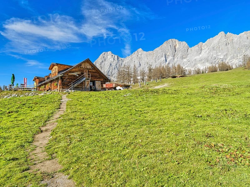 Walcheralm in front of Dachstein, alpine hut in autumn, Dachstein mountains, Dachstein south face, blue sky, Ramsau am Dachstein, Styria, Austria, Europe