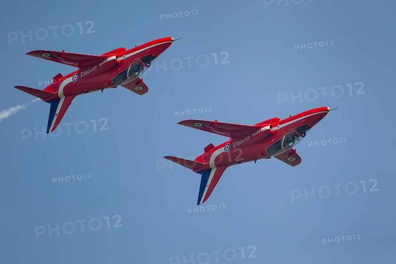 BAE Systems Hawk two aircraft of the RAF Royal air force Red Arrows display team flying, England, United Kingdom, Europe