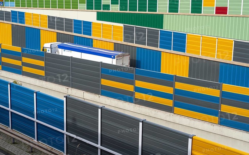 Colourful noise barriers on the A52 motorway, at the Essen-Rüttenscheid junction, the noise barriers were rebuilt in a colourful design as part of the motorway renovation, North Rhine-Westphalia, Germany, Europe