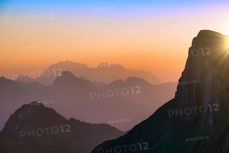 Appenzell Alps with Alpstein and Säntis at sunrise, in the foreground rock face of the Tierberg, cantons of Glarus and St. Gallen, Switzerland, Europe