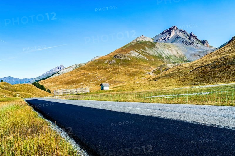 View of road and mountains at border pass Col de Larche (Colle della Maddelena), Provinz Cuneo, Département Alpes-de-Haute-Provence and Italy, France, Alps, Europe