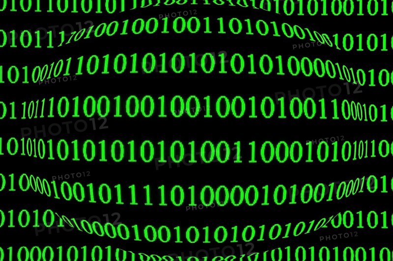 Green binary code on a black background, spherically distorted