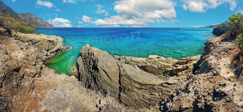 Dramatic rock formations overlooking turquoise waters, hiking trail from Avlona to Diafani, Avlona, Diafani, Karpathos, Greece, Europe