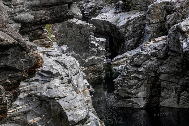 Rocks, granite rock formations in the Maggia River near Ponte Brolla, in the Maggia Valley, Valle Maggia, Canton Ticino, Switzerland, Europe