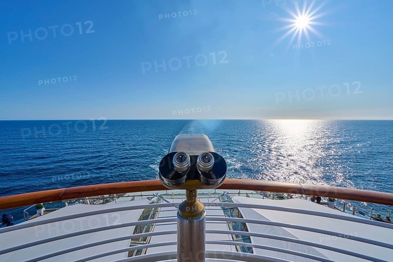View from the ship's deck, Mein Schiff 6, under bright sunshine and blue sky, binoculars at the stern, North Sea, Norway, Europe
