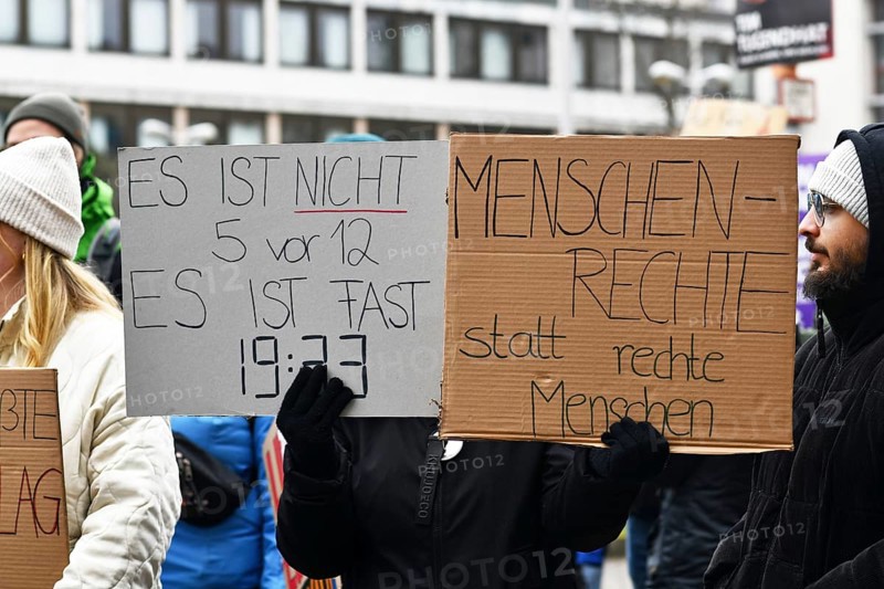 Heidelberg, Germany - February 12th 2025: People with signs with text at protest against far-right