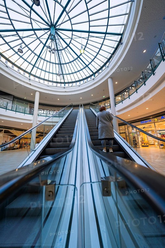 Escalator in a shopping centre leading to a large glass roof, Sterncenter Sindelfingen, Böblingen district, Germany, Europe