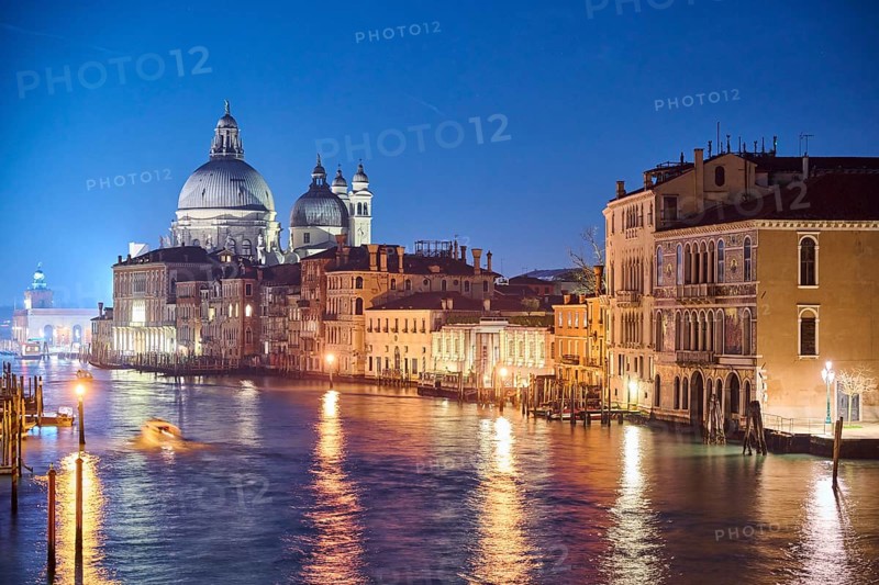 View on 'Canal Grande' at 'Ponte dell'Accademia' bridge to 'Basilica di Santa Maria della Salute' in Venice by night in winter, Italy, Europe