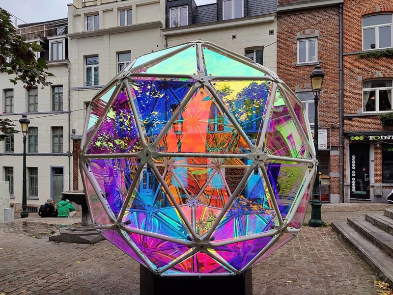 Marollescenece, art installation, title Dichroic Moon, object with a dichroic foil coating, Rue de l'Épée, Brussels, Belgium, Europe