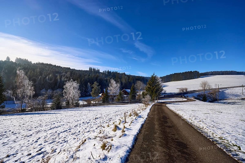 Hilly winter landscape, snow, road, blue sky with veil clouds, Titisee-Neustadt, Black Forest, Breisgau-Hochschwarzwald district, Baden-Württemberg, Germany, Europe