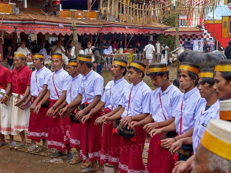 Men in traditional festive dress, funeral ceremony, Tana Toraja, Sulawesi, Indonesia, Asia