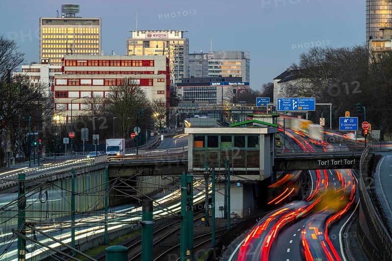 Motorway A40, Ruhr expressway, heavy traffic jam, rush hour, city passage in Essen, skyline of the city centre, underground line between the lanes, Hobeisenbrücke stop, North Rhine-Westphalia, Germany, Europe