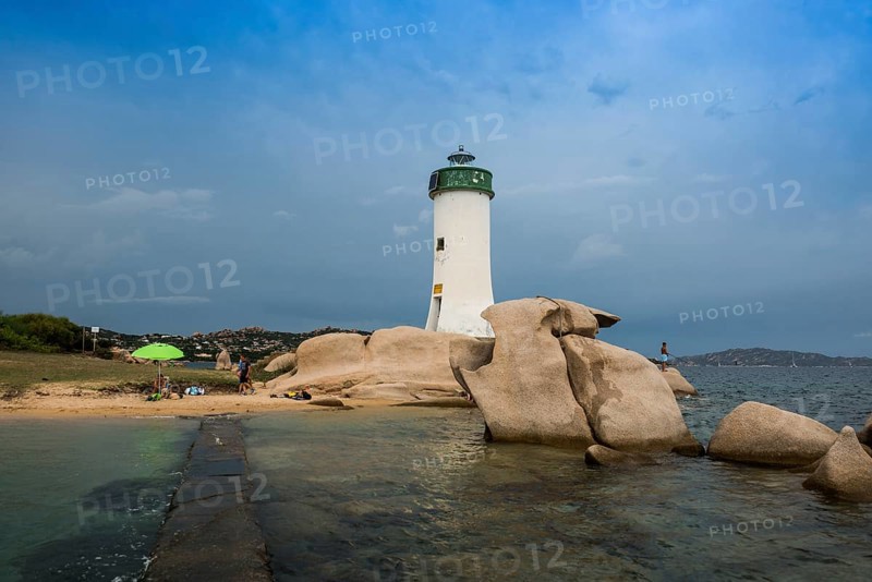 Lighthouse with beach and bizarre granite rocks, Spiaggia Porto Faro, Faro di Punta Palau, Palau, Costa Smeralda, Sardinia, Italy, Oceania