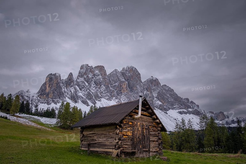 View of a part of the Geisler group from the Gampenwiese, in the foreground an alpine hut, Dolomites, snow, Puez-Geisler nature park Park, St. Magdalena, Funes, Villnößtal, South Tyrol, Italy, Europe