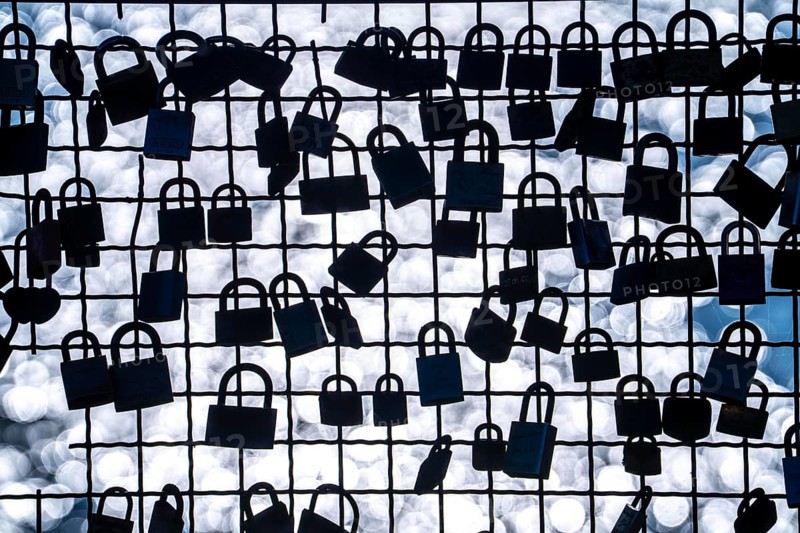 Padlocks, so-called love locks on a fence, vantage point in Wesel am Rhein, North Rhine-Westphalia, Germany, Europe