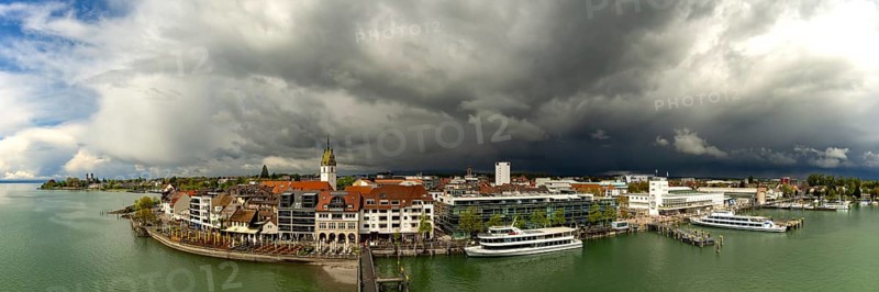 Panorama from the Moleturm tower onto the lakeside promenade of Friedrichshafen on Lake Constance as a thunderstorm approaches, Upper Swabia, Baden-Württemberg, Germany, Europe