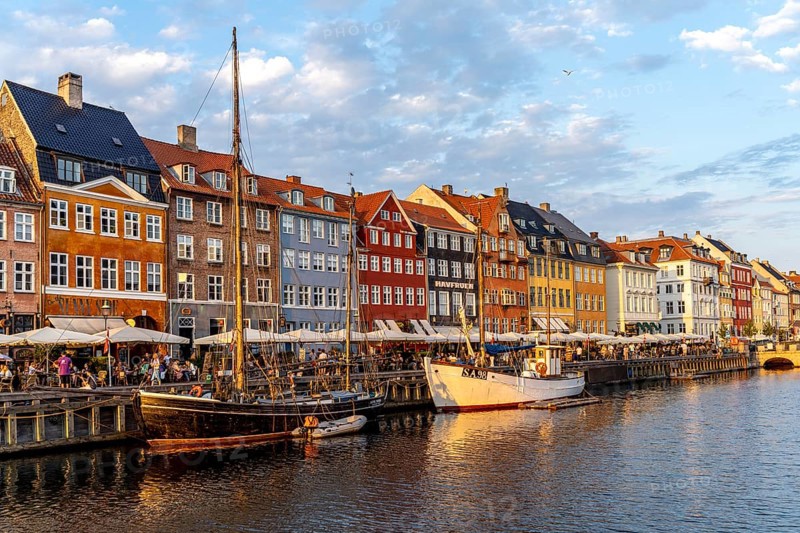 Colourful houses, restaurants and historic ships on the Nyhavn canal and harbour, Copenhagen, Denmark, Europe