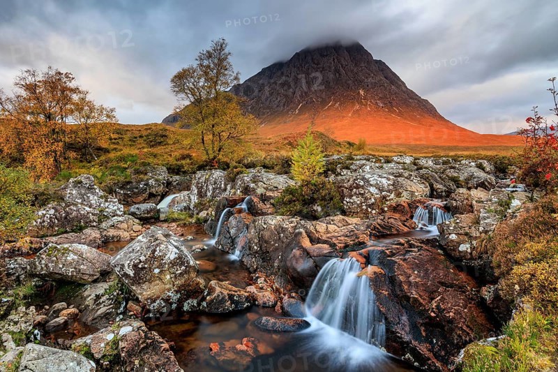 Wild river, waterfall, autumn colours, morning light, mountain landscape, cloudy mood, Buachaille Etive Mòr, Glencoe, Scottish Highlands, Scotland, Great Britain
