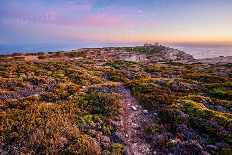 Cabo Espichel cape Espichel on Atlantic ocean at sunset with ruins