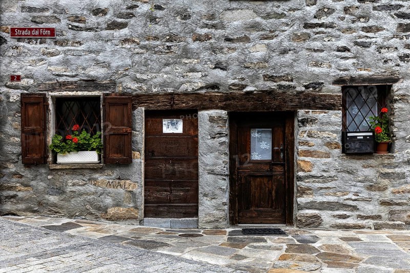 Entrance door and window of a typical Ticino stone house in the village of Sonogno, Verzasca Valley, Valle Verzasca, Canton Ticino, Switzerland, Europe