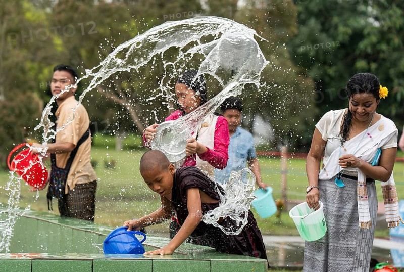 NAMSAI, INDIA.- APRIL 16: Devotees celebrate the vibrant Sangken Festival by pouring water over each other at Golden Pagoda in Namsai, India on 16 April 2025. Sangken Festival is a beautiful and culturally rich water festival celebrated primarily by the Theravada Buddhist communities, it marks the Buddhist New Year, typically falling in mid-April