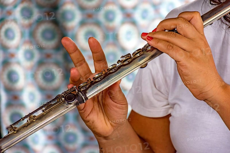 Detail of the hands of a woman playing the transverse flute during a musical performance Belo Horizonte, Minas Gerais, Brazil, South America