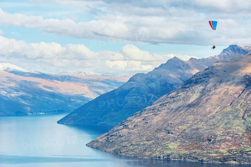 Paragliding over the Remarkables mountain range, Queenstown, South Island, New Zealand, Oceania