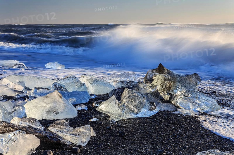 Ice floes on the beach, waves, sea, sunny, morning light, winter, Diamond Beach, Breidamerkursandur, Jökulsarlon, Iceland, Europe