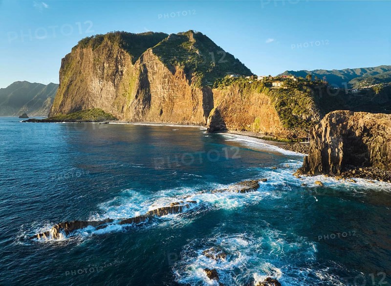 Aerial view of Madeira cliffs coastline landscape on sunrise, Guindaste viewpoint, Madeira island, Portugal, Europe
