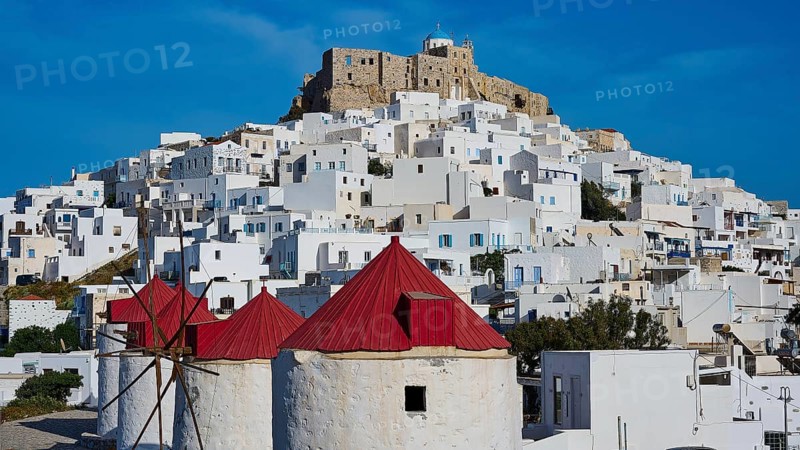 Castle and windmills above white houses under a sunny sky, Querini Castle, Chora, Astypalea, Dodecanese, Greek Islands, Greece, Europe
