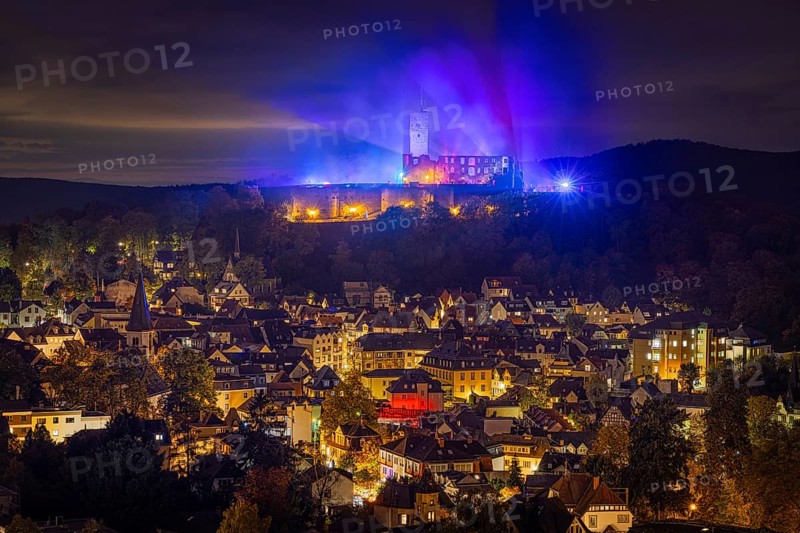 The castle in the town of Königstein im Taunus is brightly illuminated in the evening. From 18 October to 3 November 2024, the castle ruins will host the Frankenstein Halloween Festival under the motto A new Chapter of Fear, Taunus, Königstein, Hesse, Germany, Europe