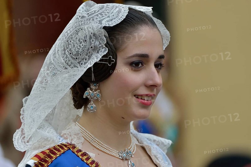 Fallas festival, woman in a traditional costume during the parade in the Plaza de la Virgen de los Desamparados, Valencia, Spain, Europe