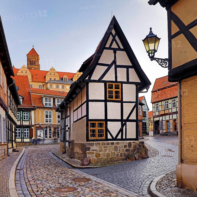 Half-timbered houses in Finkenherd with Schlossberg, alley in the old town centre of the World Heritage town of Quedlinburg, Saxony-Anhalt, Germany, Europe