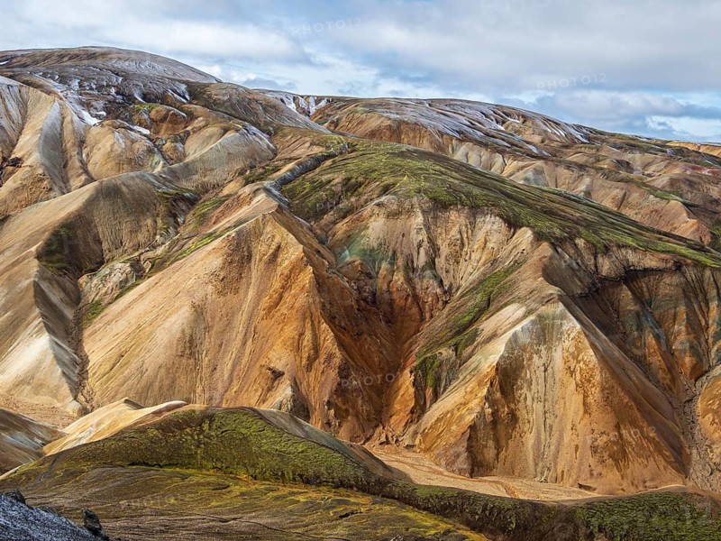 Early snow on the colorful rhyolite mountains, Landmannalaugar, Fjallabak Nature Reserve, Iceland, Europe
